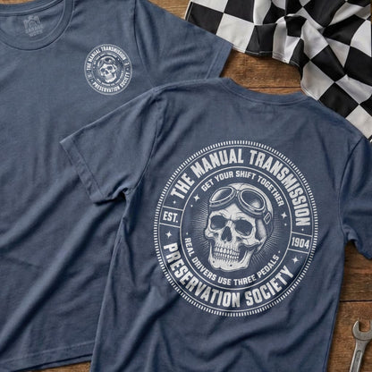 Blue t-shirt with "The Manual Transmission Preservation Society" circular logo featuring a skull and goggles.