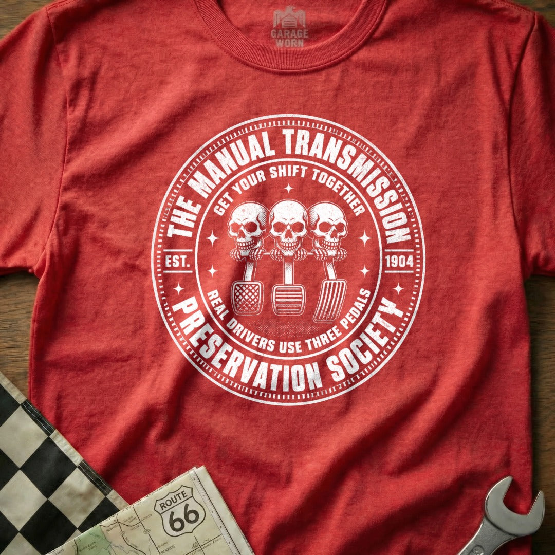 Red shirt with "Manual Transmission Preservation Society" and skull design.
