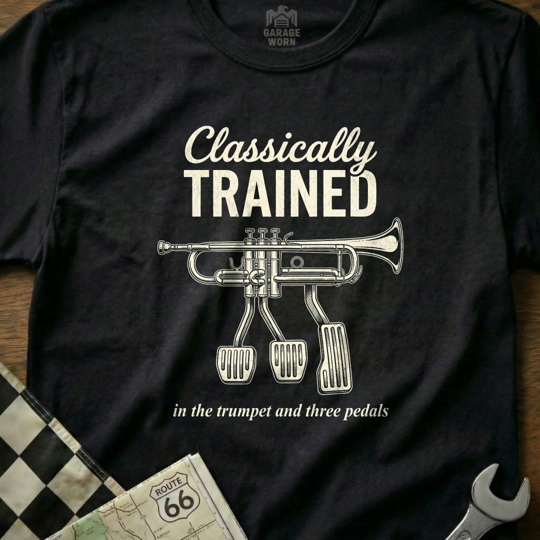Black t-shirt with "Classically Trained" and trumpet with pedals.