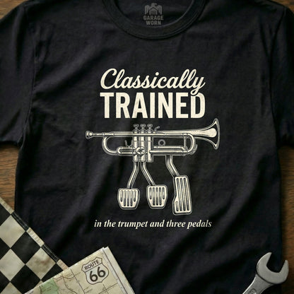 Black t-shirt with "Classically Trained" and trumpet with pedals.