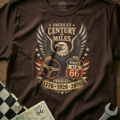 Brown t-shirt with eagle, Route 66 shield, steering wheel, and dates.