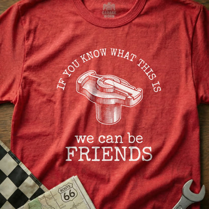 Red t-shirt with a distributor cap illustration and "we can be FRIENDS" text.