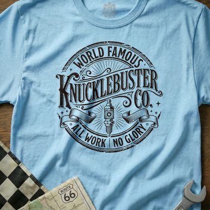 Light blue t-shirt with "World Famous KnuckleBuster Co. All Work No Glory" text.