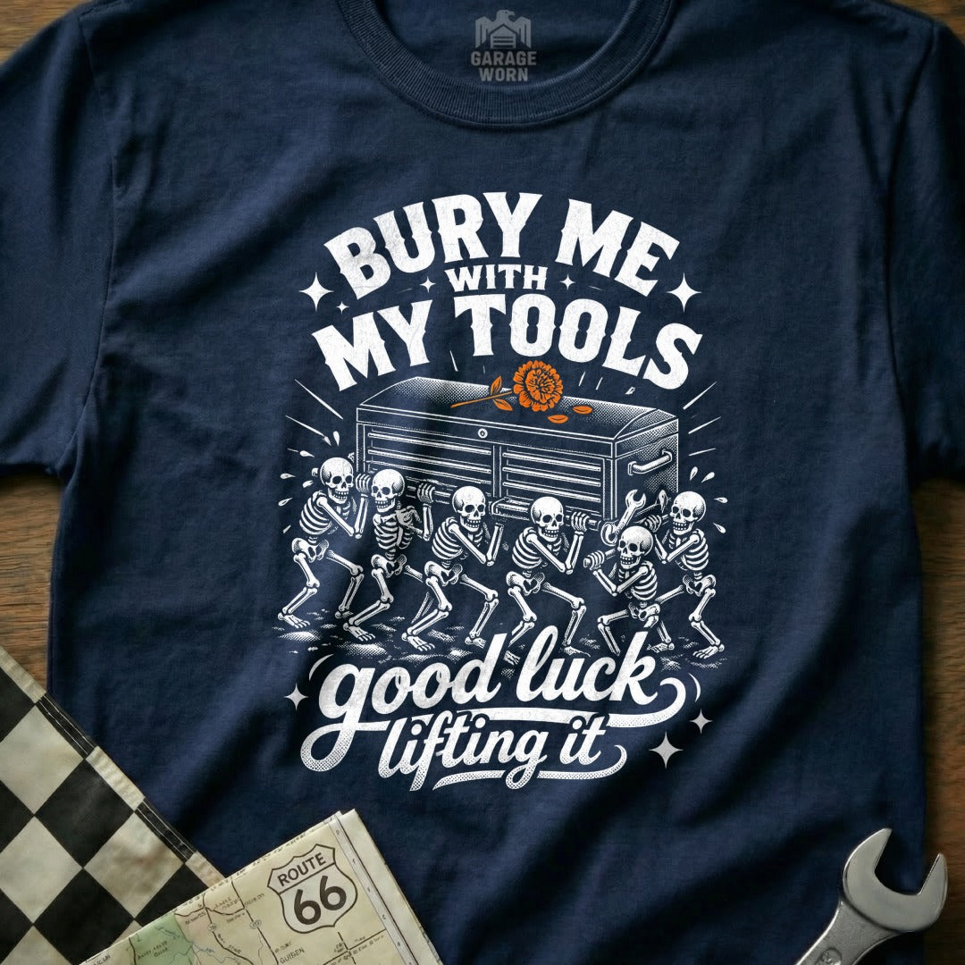 Navy t-shirt with skeletons carrying a toolbox and text "Bury Me With My Tools Good Luck Lifting It".