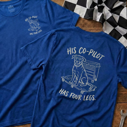 Blue t-shirt with "His Co-Pilot Has Four Legs" and a dog on a skateboard.