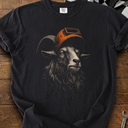 Black t-shirt with a detailed illustration of a ram wearing an orange welding mask.