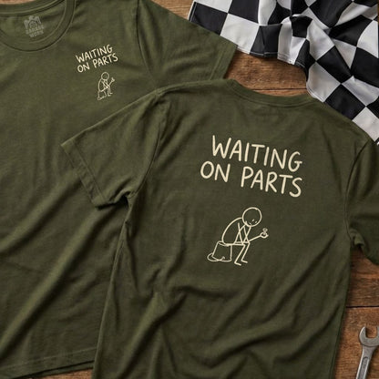Two olive green t-shirts with "WAITING ON PARTS" and stick figure drawing.
