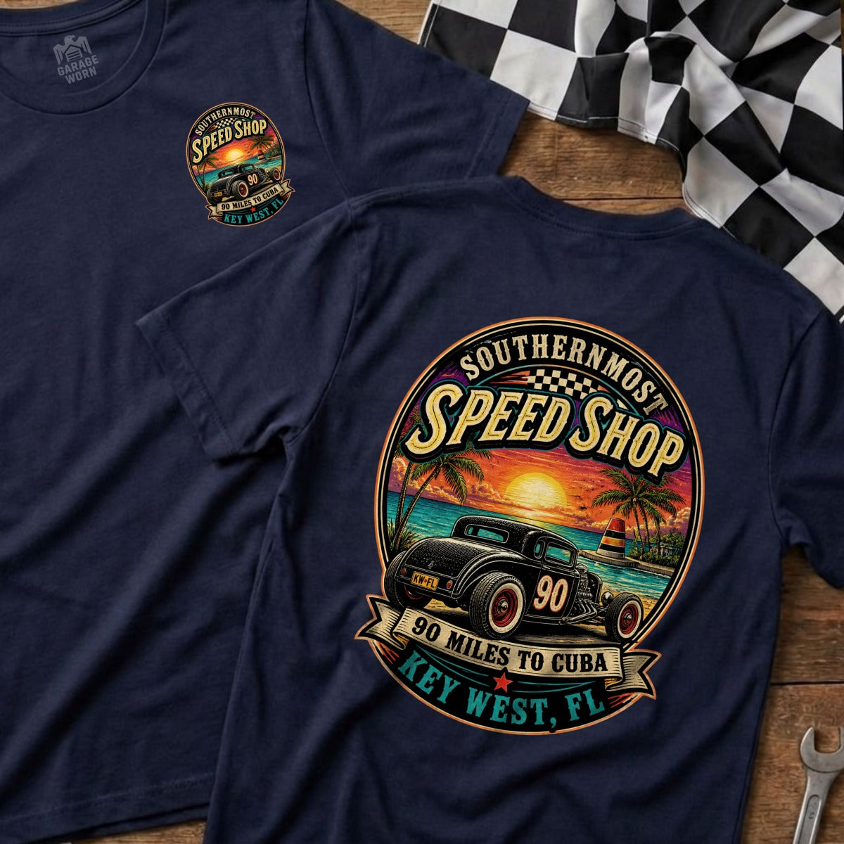 Dark navy t-shirt featuring a circular graphic of a hot rod with "Southernmost Speed Shop" and "Key West, FL".
