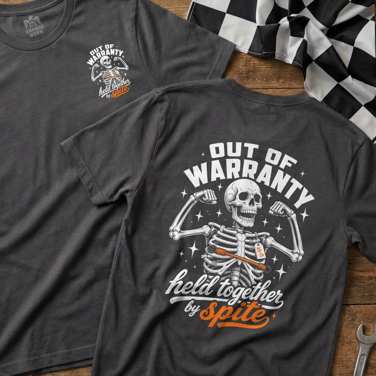 Dark grey t-shirt with a skeleton graphic and "Out of Warranty" text.