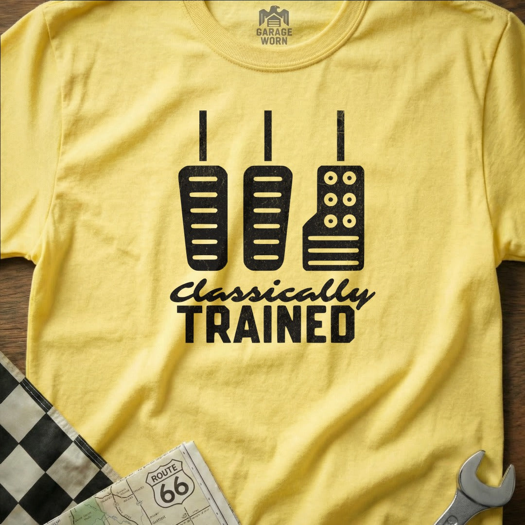Yellow t-shirt with "CLASSICALLY TRAINED" and three pedals graphic.