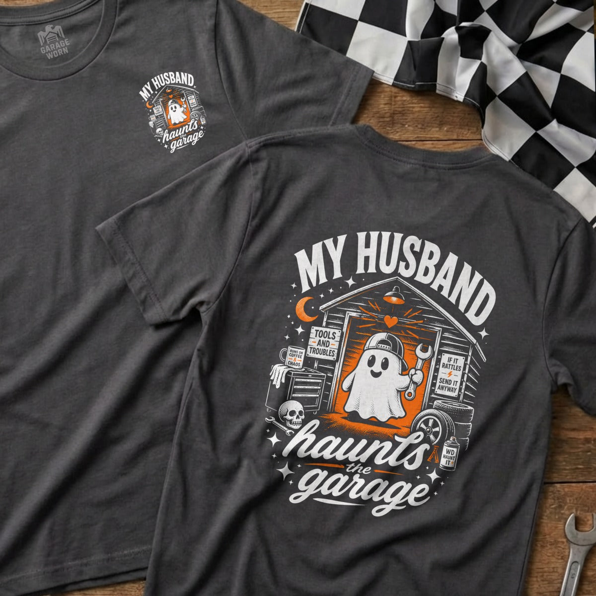 Gray t-shirt with a graphic of a ghost in a garage with tools and the text "My Husband Haunts the Garage".