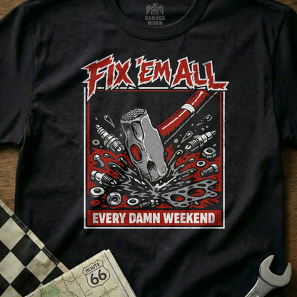 Black t-shirt with "Fix 'Em All" and hammer smashing engine parts design.