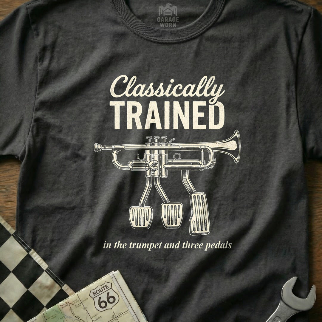 Black t-shirt with "Classically Trained" and trumpet with three pedals graphic.