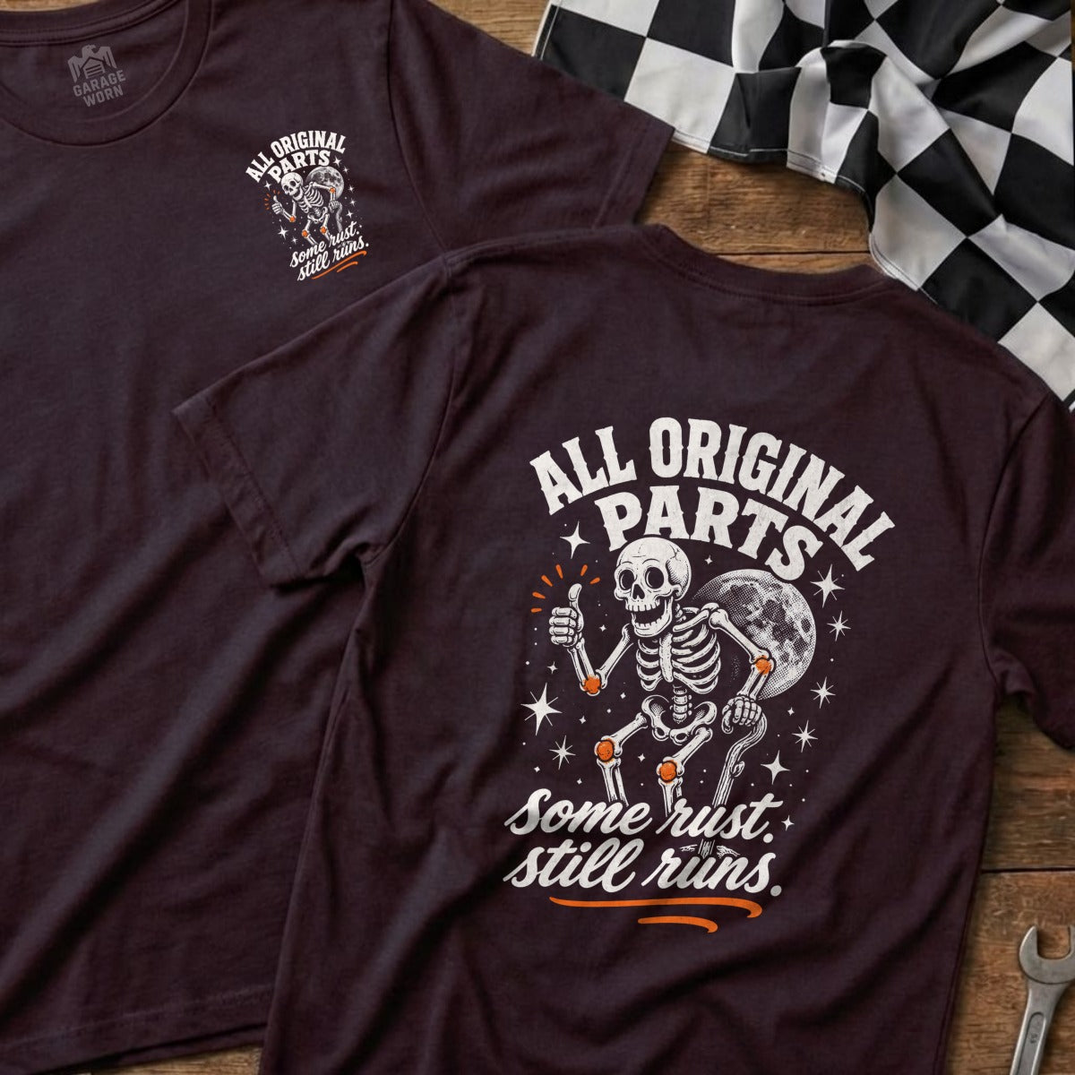 Dark t-shirt with skeleton graphic and text "All Original Parts. Some rust. Still runs."