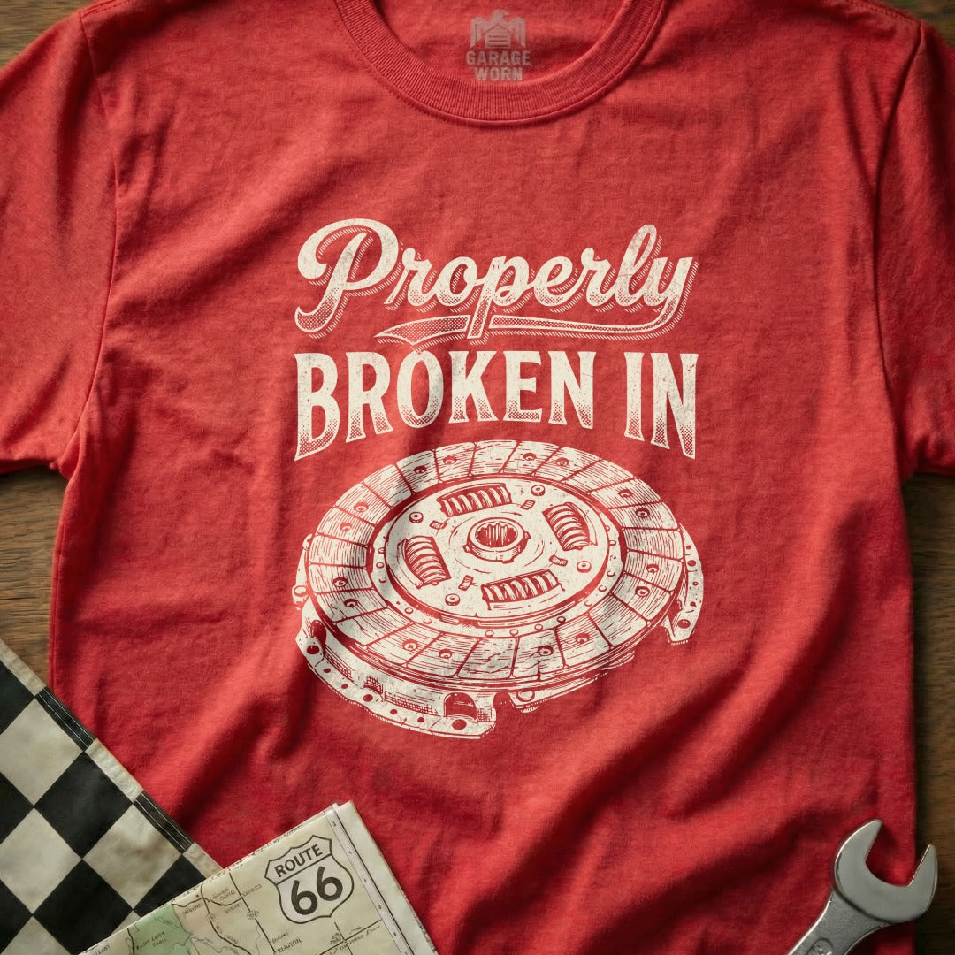 Red t-shirt with "Properly Broken In" and clutch illustration.