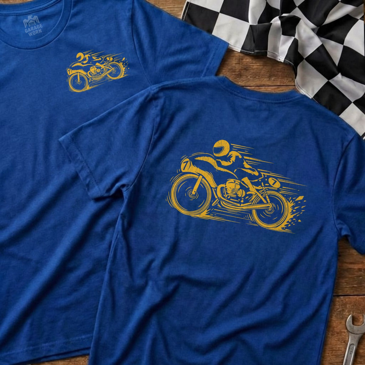 Two blue t-shirts with yellow motorcycle graphic and "Garage & Worn" logo.