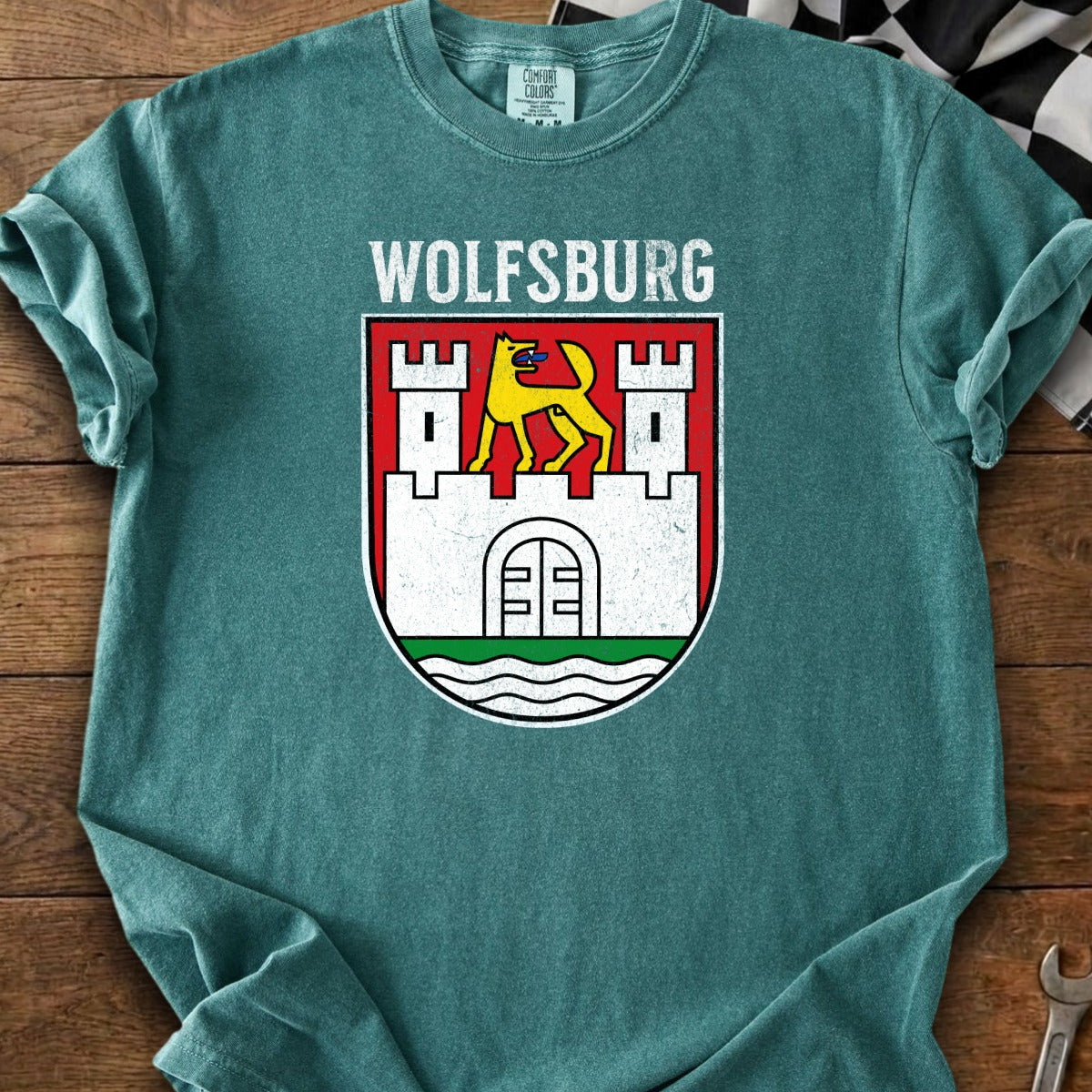 T-shirt with Wolfsburg crest: yellow wolf on white castle on red shield.