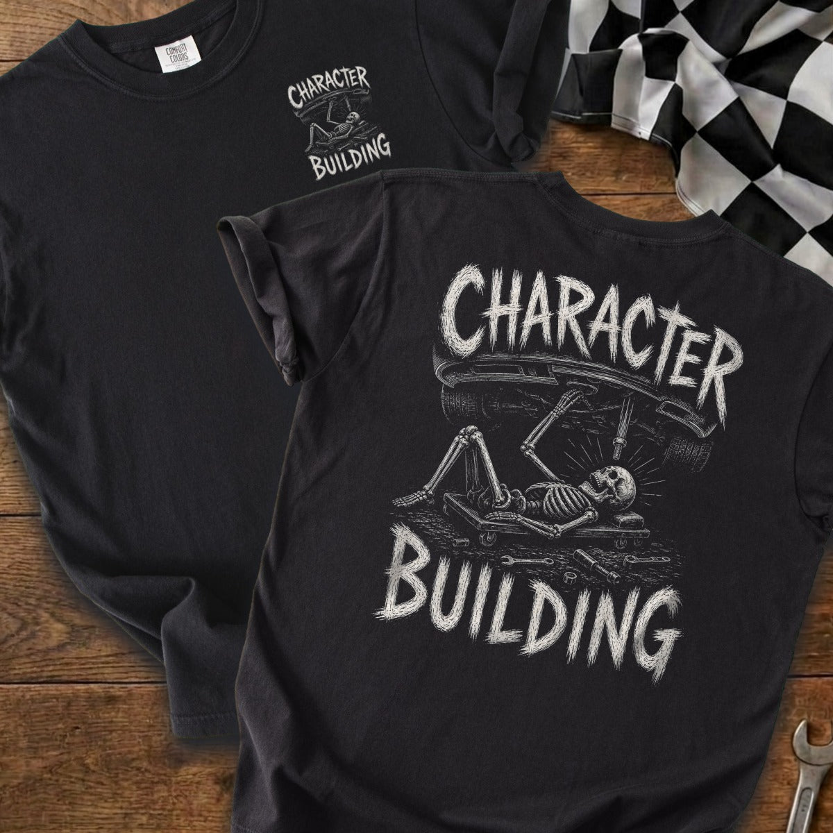 Black t-shirt with "CHARACTER BUILDING" and skeleton mechanic graphic.