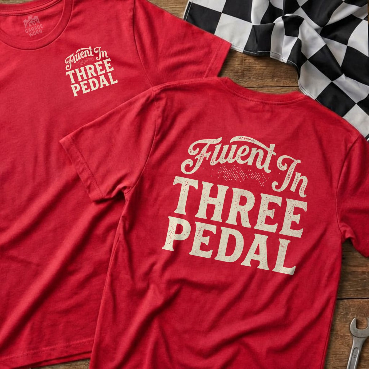 Red t-shirts with "Fluent In THREE PEDAL" text and Garage Work logo.