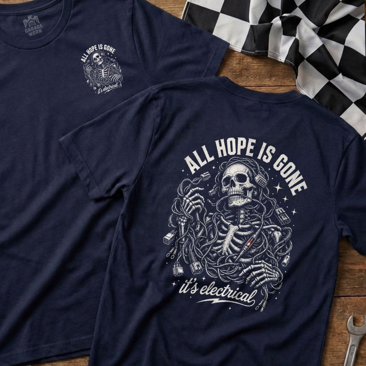 Dark navy t-shirt with a skeleton tangled in wires, wearing headphones. Text reads "ALL HOPE IS GONE" and "it's electrical".