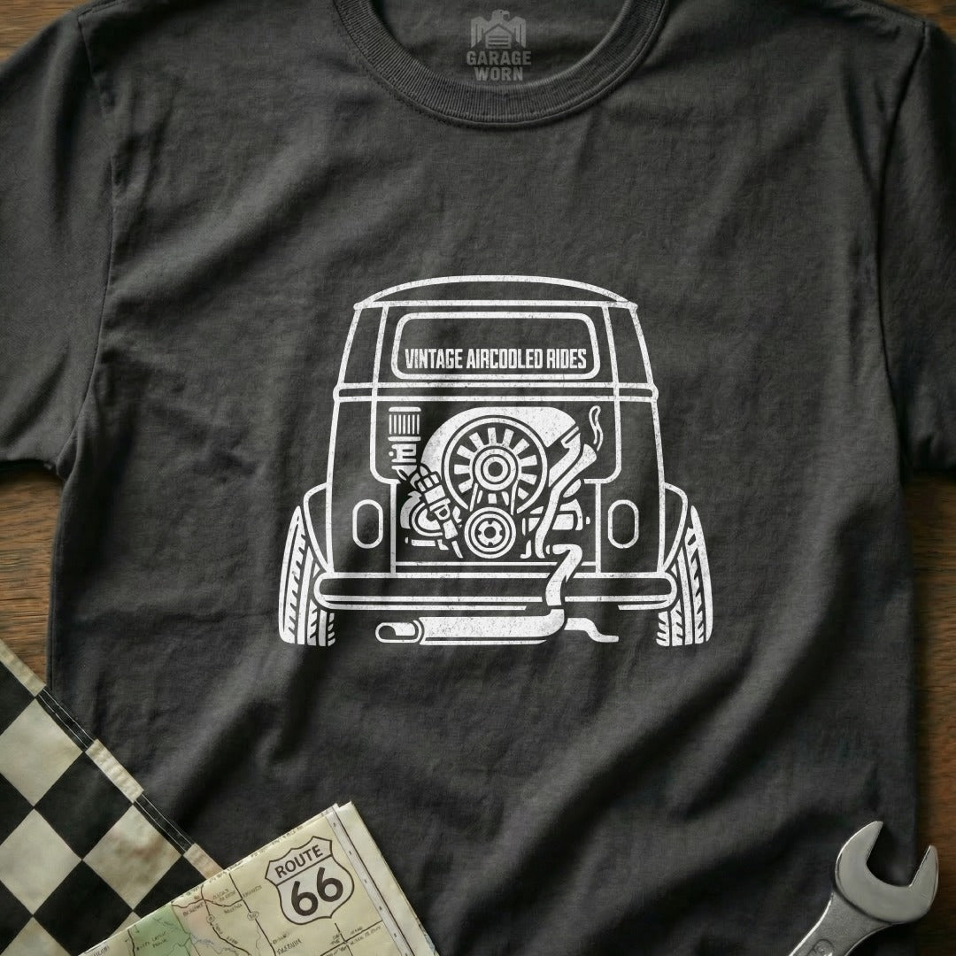 Dark t-shirt with white line drawing of a vintage air-cooled engine in a vehicle.