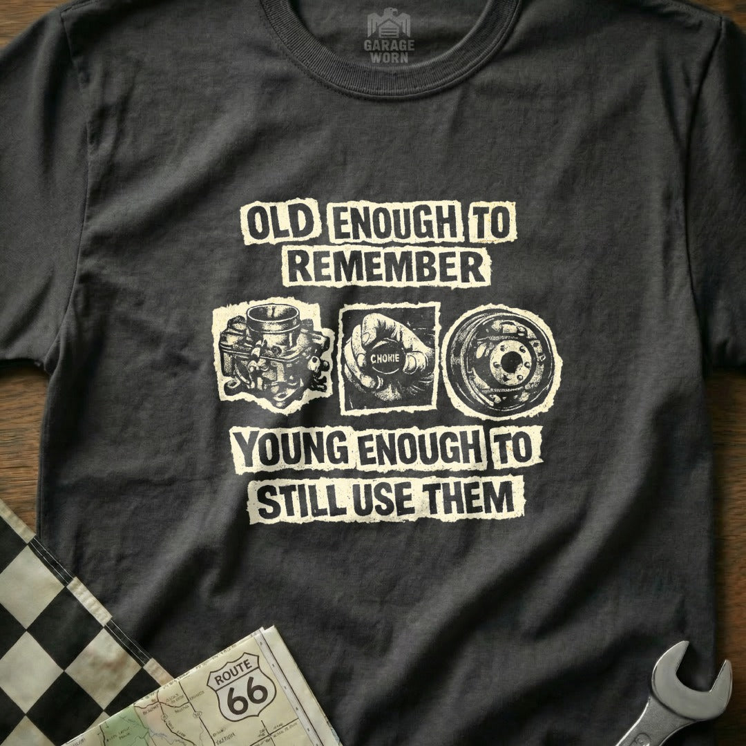 T-shirt with "Old enough to remember, young enough to still use them" and vintage car parts.