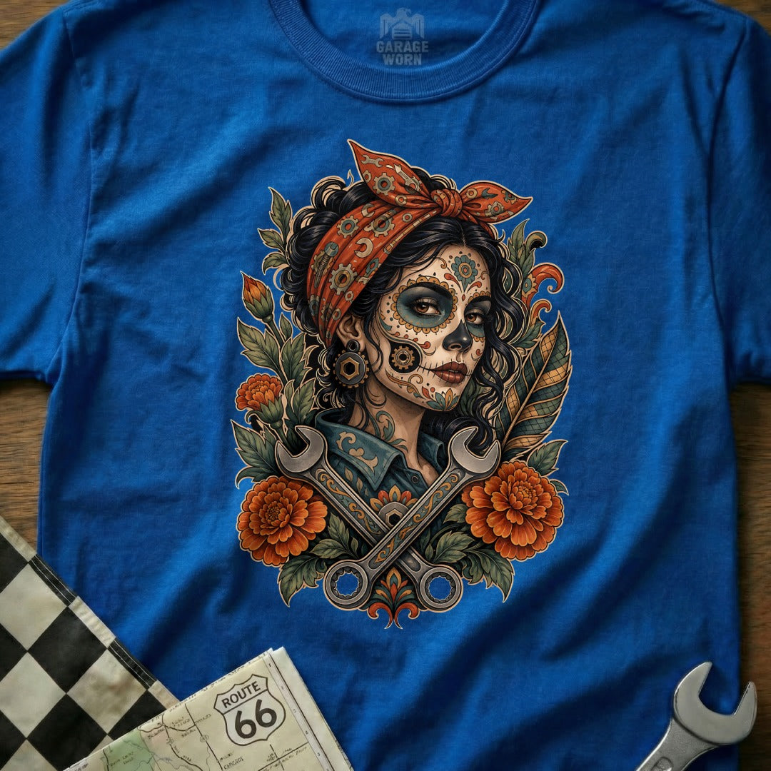 Dia de los Muertos woman in bandana with wrenches and flowers.