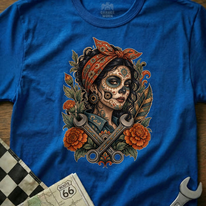Dia de los Muertos woman in bandana with wrenches and flowers.