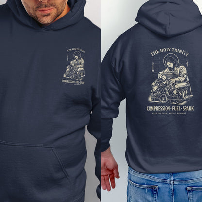 Navy hoodie with Jesus working on an engine, "The Holy Trinity" and "Compression Fuel Spark" text.
