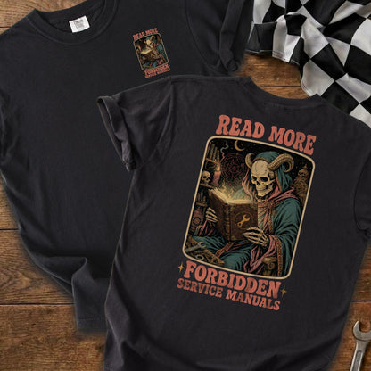 Black t-shirt with "Read More Forbidden Service Manuals" graphic featuring a skeleton grim reaper reading a book.