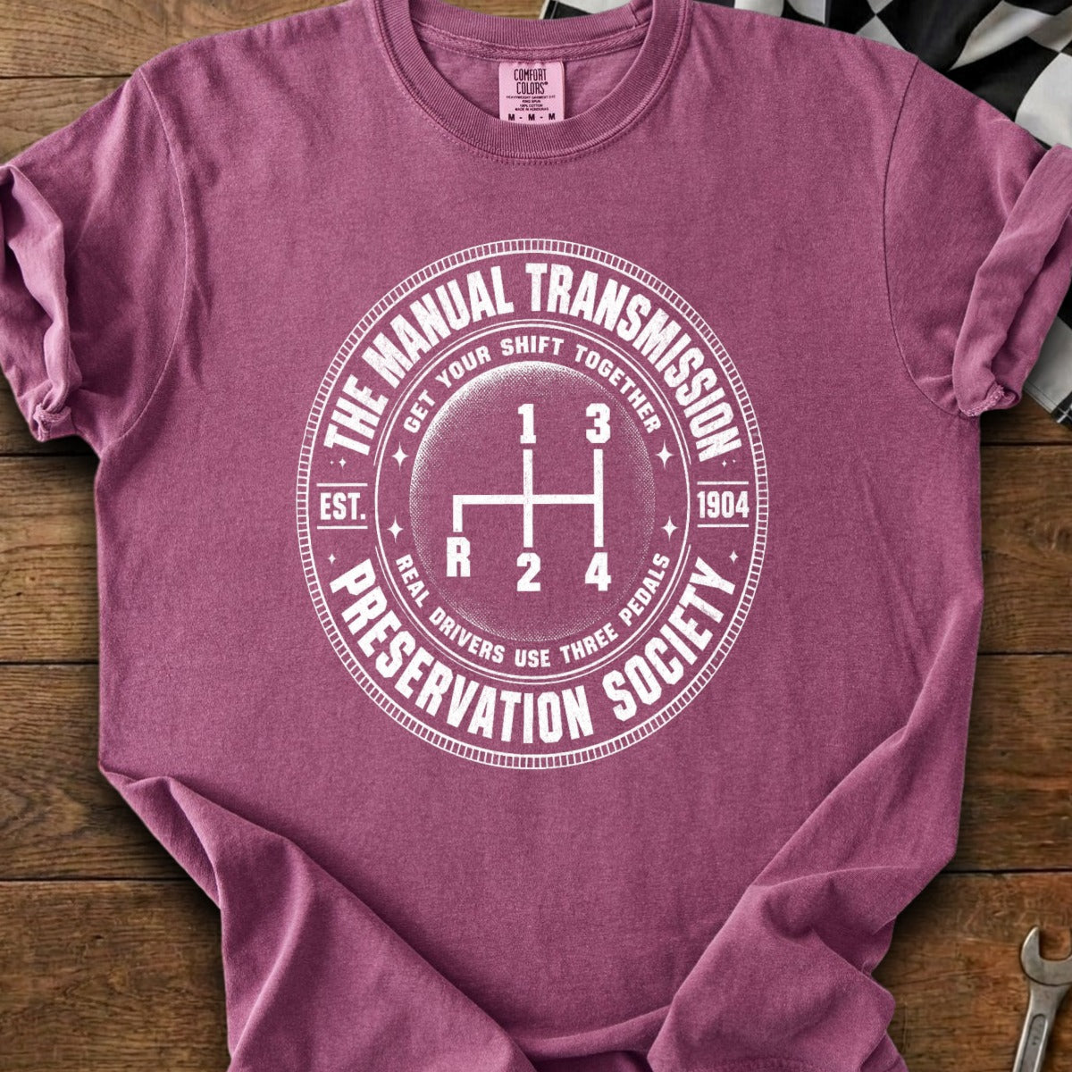 T-shirt with "The Manual Transmission Preservation Society" and gear shift graphic.