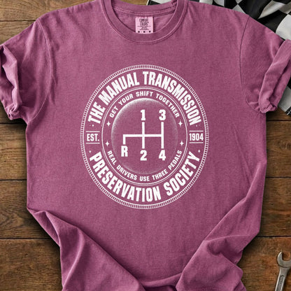 T-shirt with "The Manual Transmission Preservation Society" and gear shift graphic.