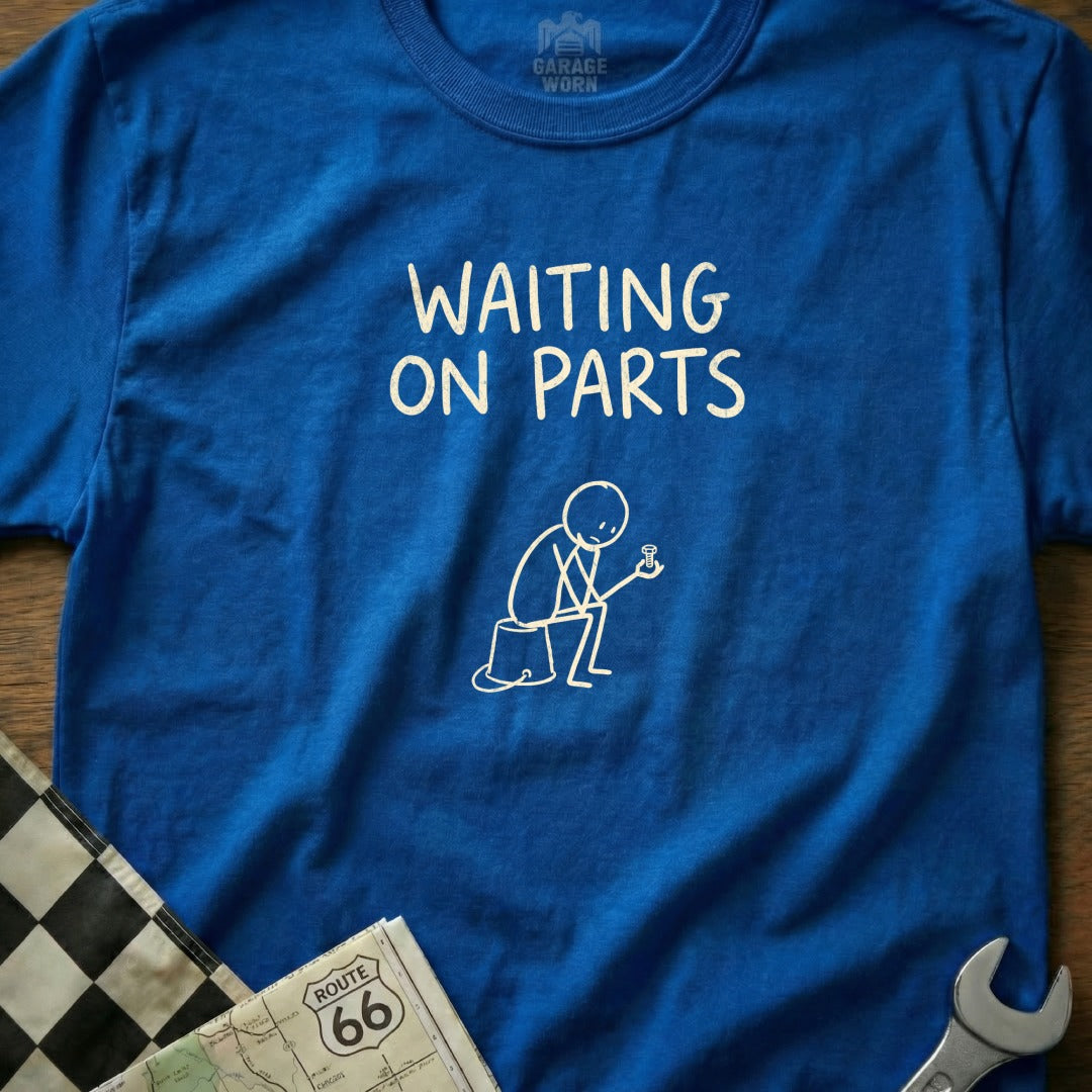 Blue t-shirt with "WAITING ON PARTS" and a stick figure with a bolt.