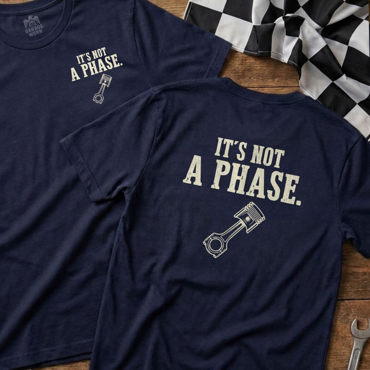Dark navy t-shirts with "It's not a phase." and piston graphic.