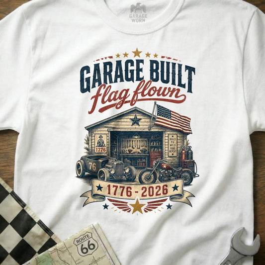 "Garage Built, Flag Flown" graphic with a hot rod, motorcycle, and garage scene.
