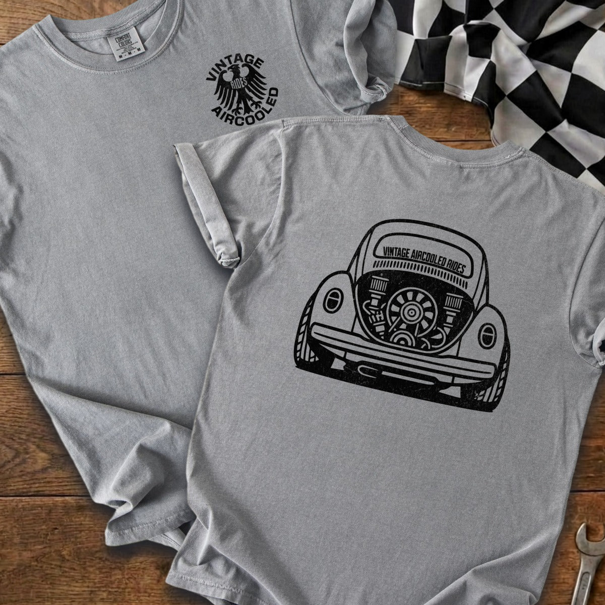 Gray t-shirts with black graphic of a vintage Volkswagen Beetle engine and racing flag.