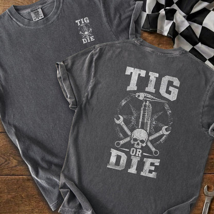 Dark grey t-shirt with "TIG OR DIE" text and skull graphic.