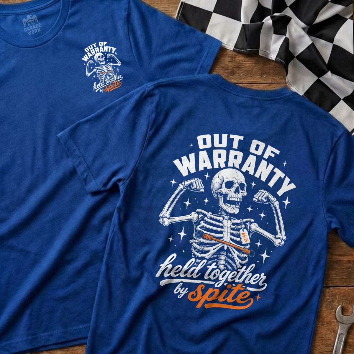 Blue t-shirt with graphic of skeleton flexing, "Out of Warranty" and "Held Together by Spite" text.