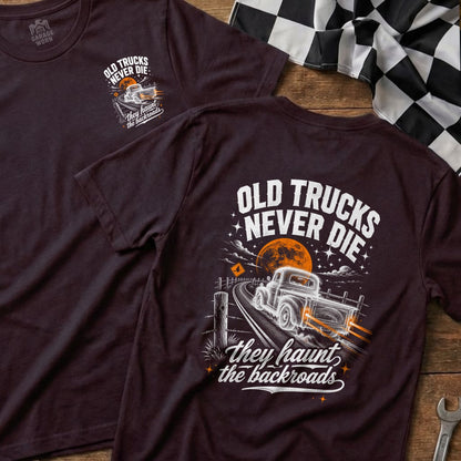 Dark t-shirt with graphic of old truck driving on a road under a full moon.