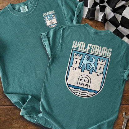 Teal t-shirt with Wolfsburg crest on front and back.