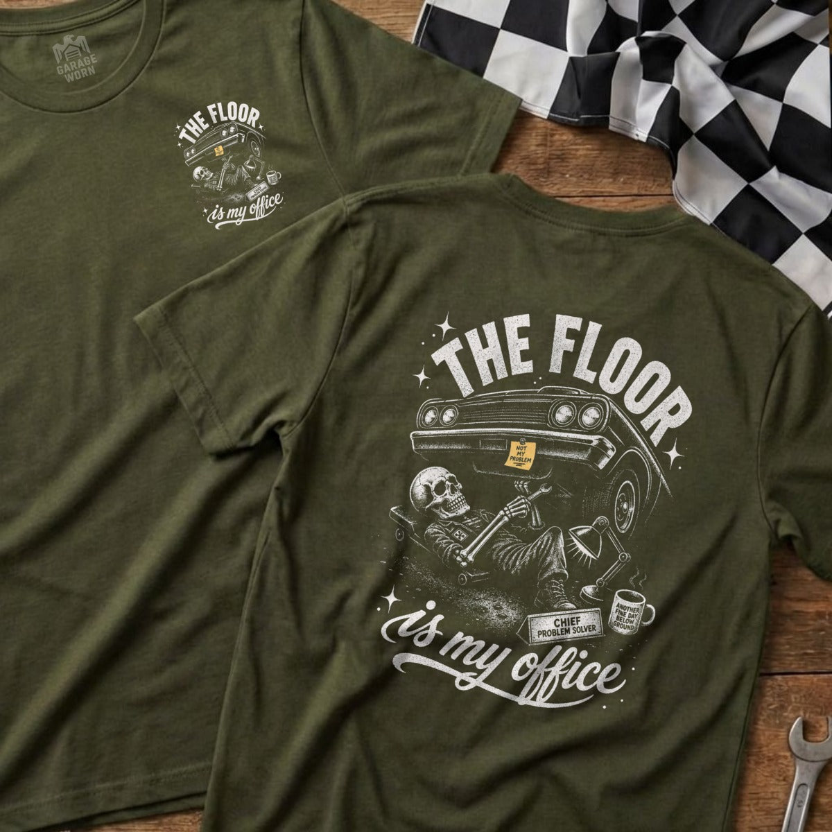Green t-shirt with skeleton working on car graphic and text "The floor is my office".