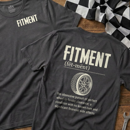 Dark grey t-shirt with "FITMENT" in white text and a tire tread graphic.