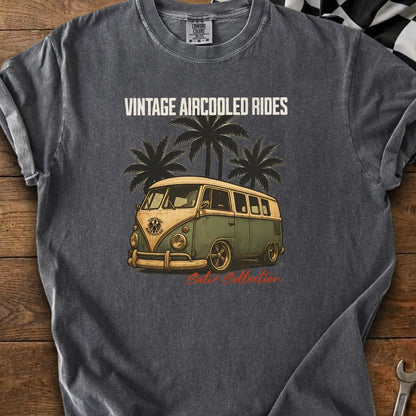 Vintage aircooled rides graphic on a dark t-shirt with a retro van and palm trees.
