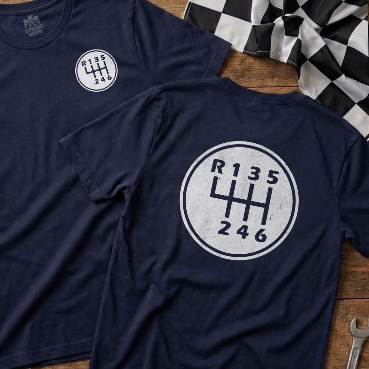 Navy t-shirt with white manual transmission shift pattern graphic.