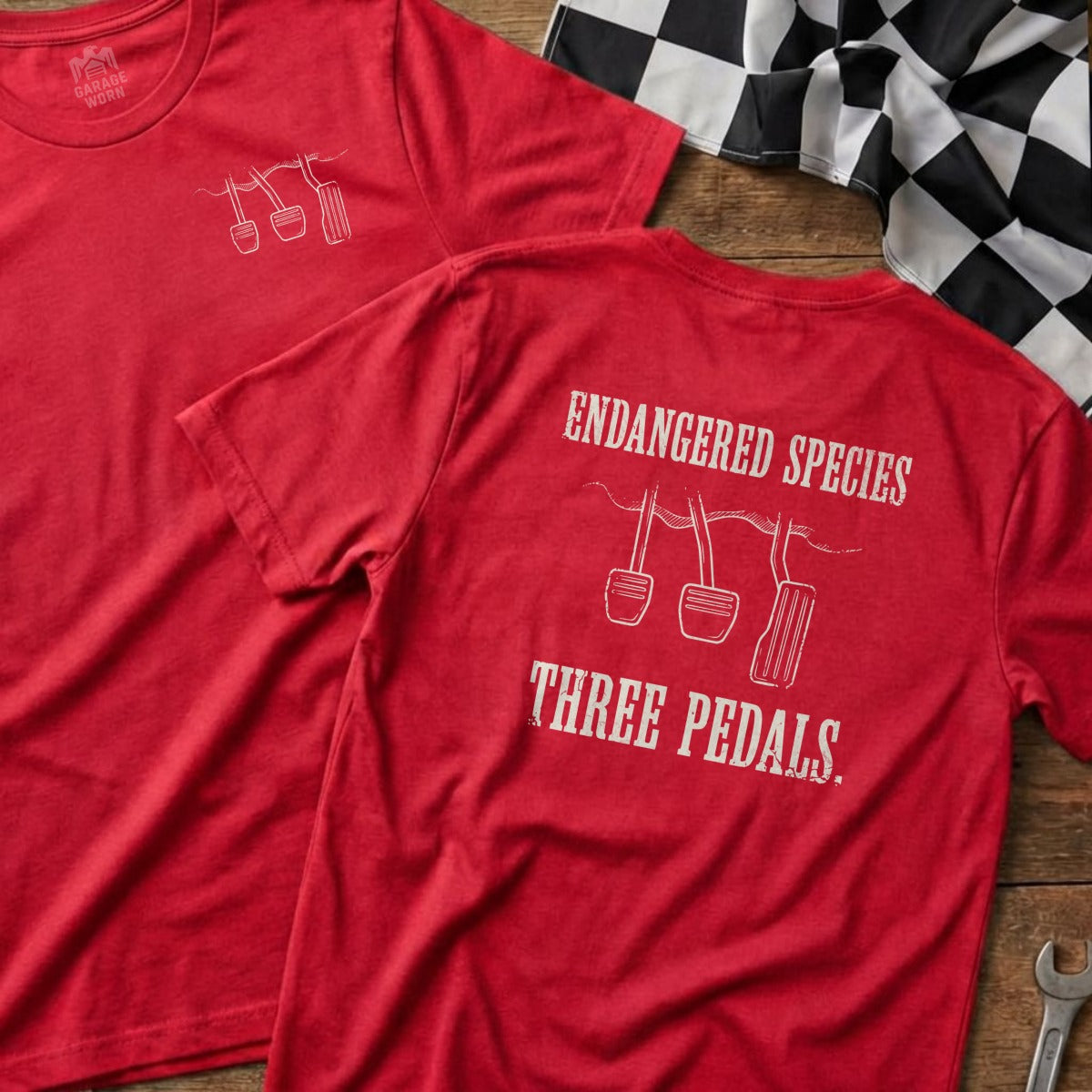 Red t-shirt with "Endangered Species Three Pedals" and pedal graphics.