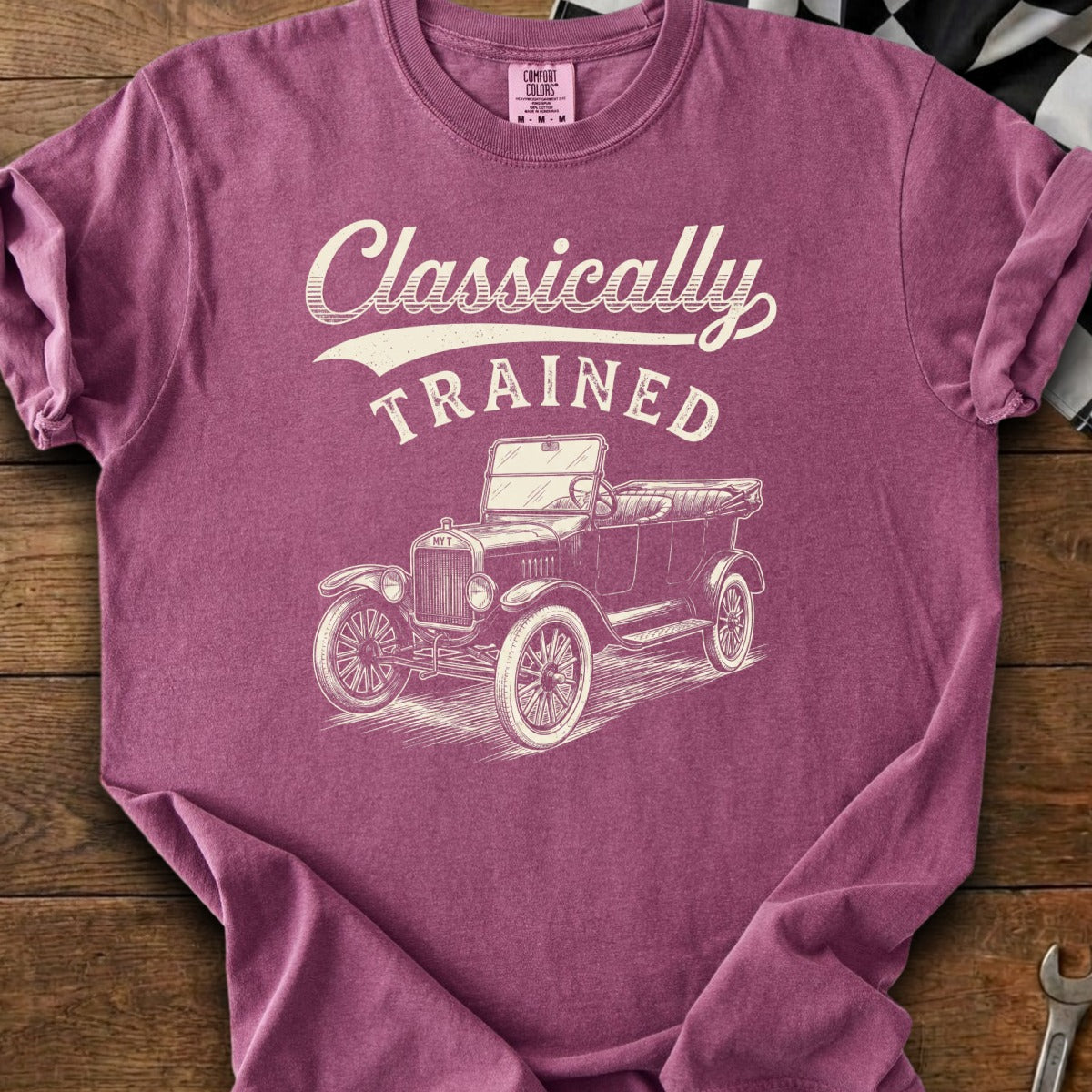 Vintage car graphic with text "Classically TRAINED" on a maroon t-shirt.