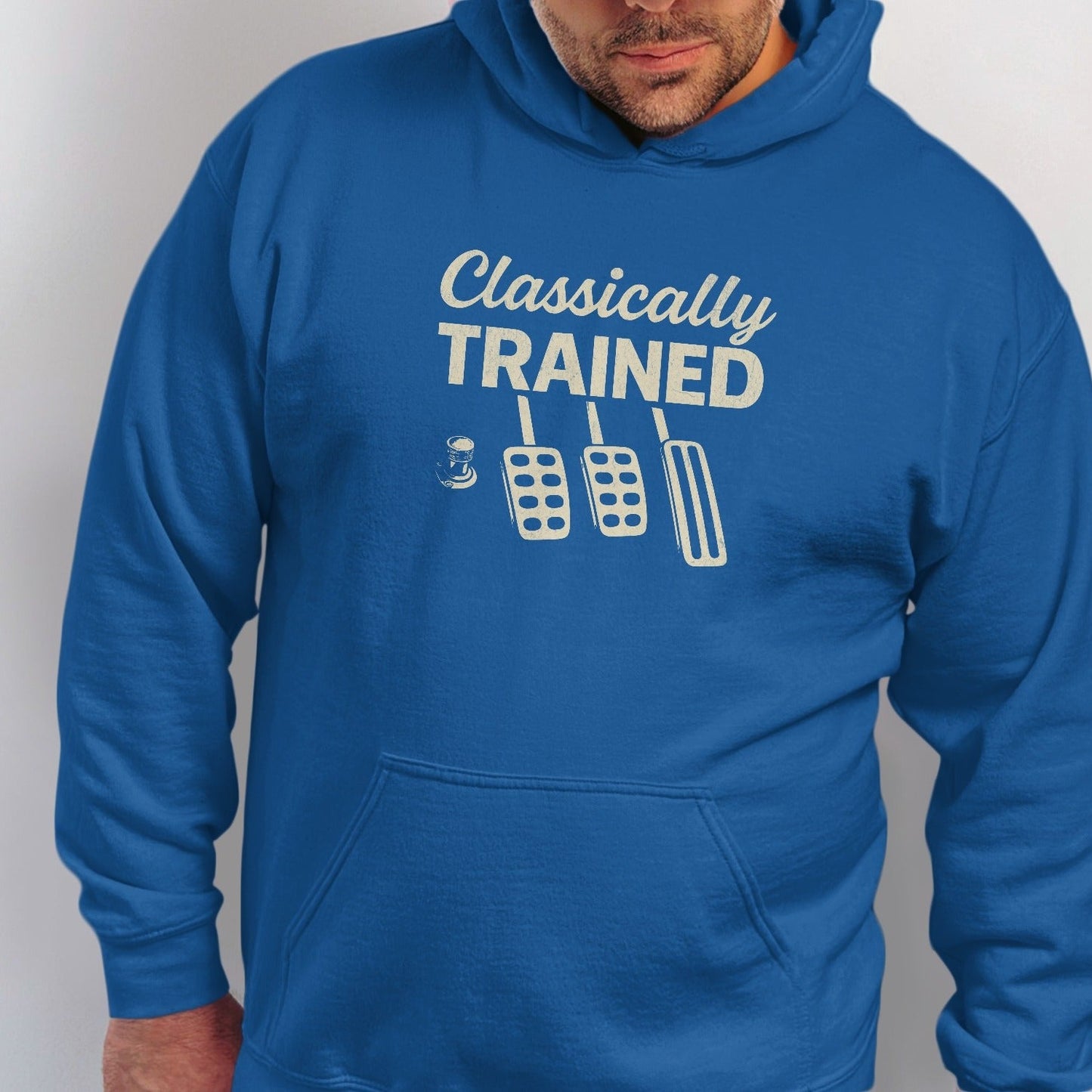 Blue hoodie with "Classically TRAINED" text and car pedals graphic.