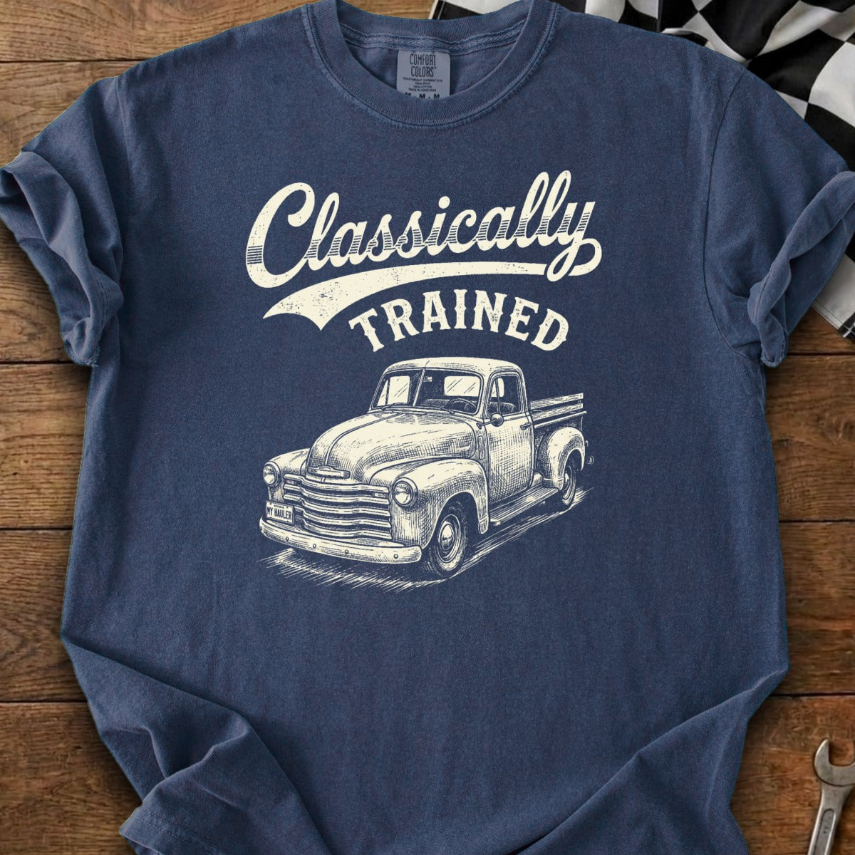 Navy t-shirt with "Classically TRAINED" text and a vintage truck graphic.