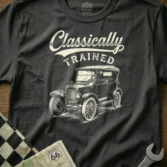 Dark t-shirt with graphic of a vintage car and text "Classically TRAINED".