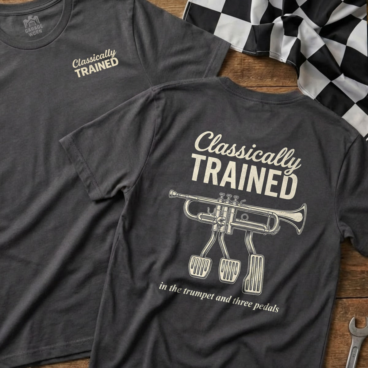 Dark gray t-shirt with "Classically Trained in the trumpet and three pedals" and trumpet graphic.